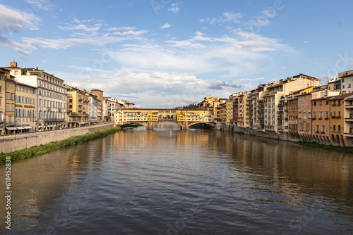 The Arno river in Florence Italy with Ponte Vecchio  the historic bridge from a distance.
