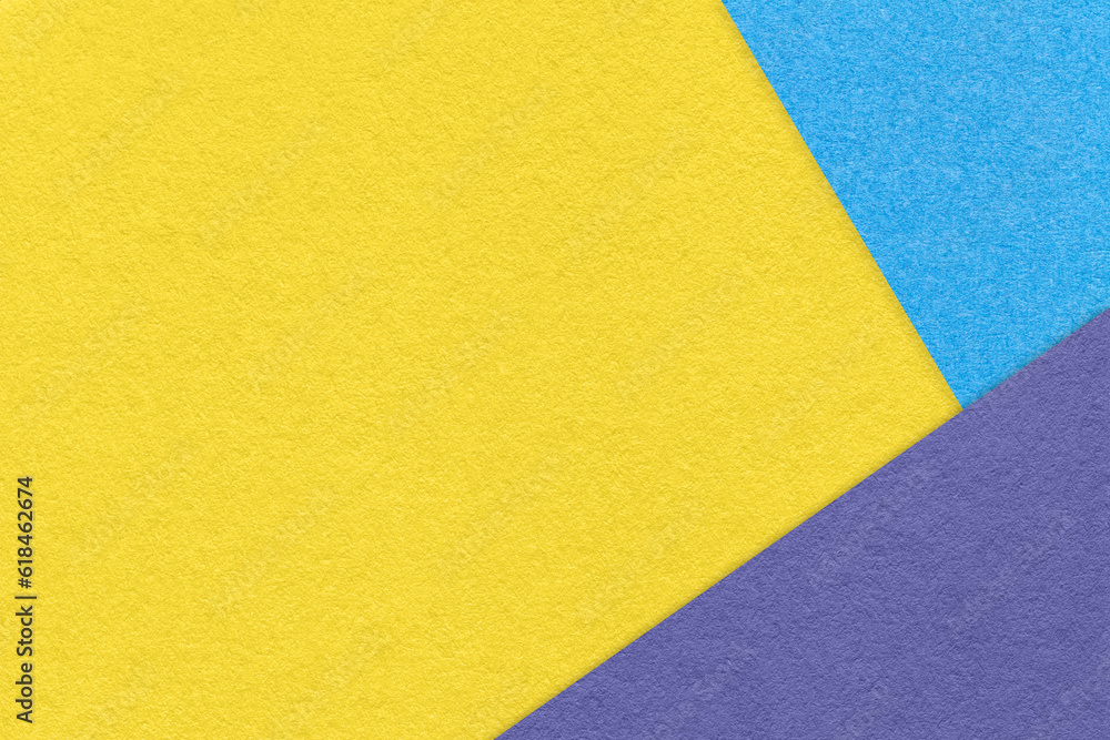 Texture of craft light yellow color paper background with blue and violet border. Vintage abstract cardboard. Texture of craft light yellow color paper background with blue and violet border. Vintage abstract cardboard.