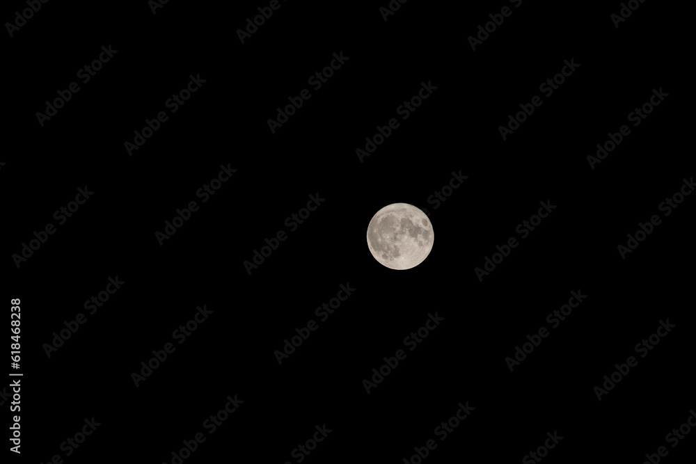 Night sky with full bright moon in the clouds Night sky with full bright moon in the clouds