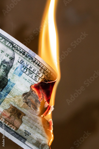 Burning dollar bill close up, copy space