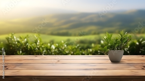 Wooden table blurred tea plantation background morning