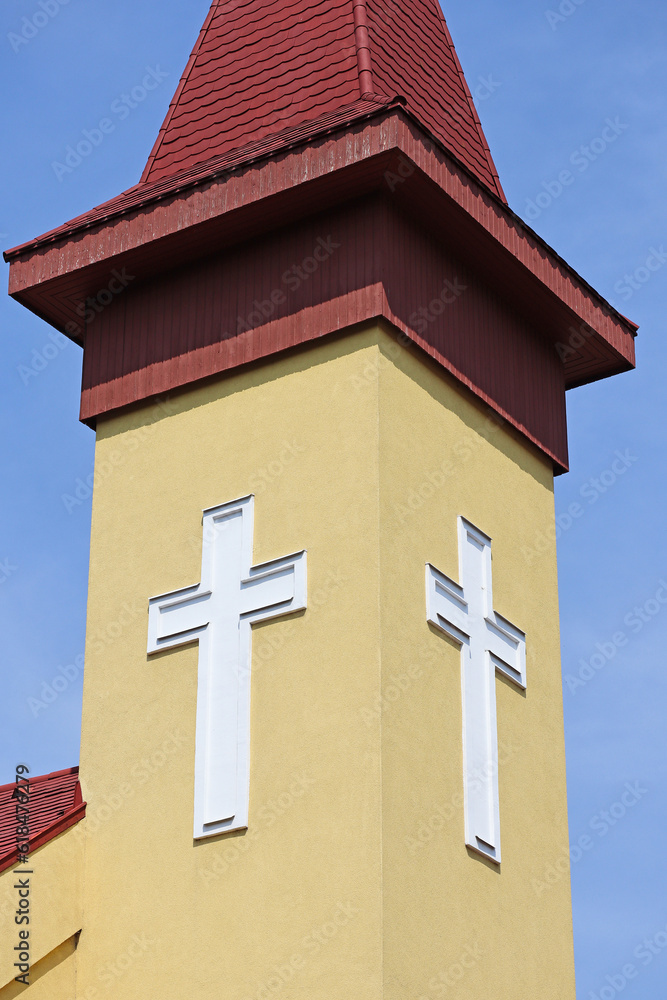 White crosses on the tower of the church