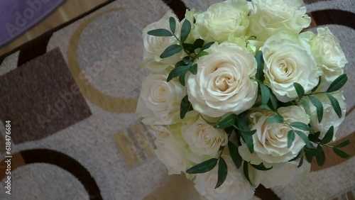 Beautiful modern bridal bouquet of fresh white roses. Flowers arrangement for celebration.