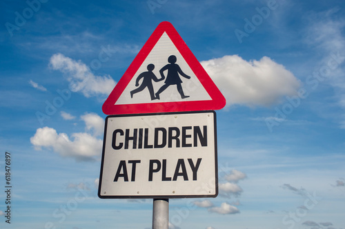 Children at play road sign against a blue sky