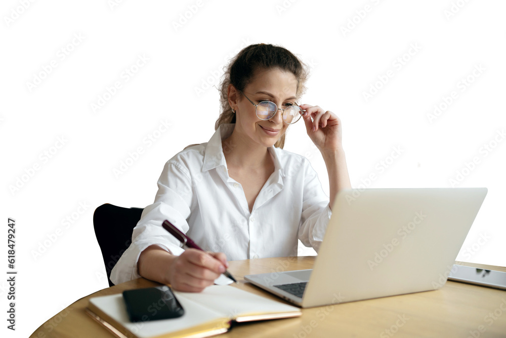 The administrator in glasses is a smart woman sitting at work using a laptop. Online training student education on the website . transparent background, png. The administrator in glasses is a smart woman sitting at work using a laptop. Online training student education on the website . transparent background, png.