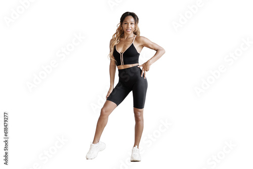 A full-length athletic woman in fitness clothes doing a workout for the body. transparent background, png.