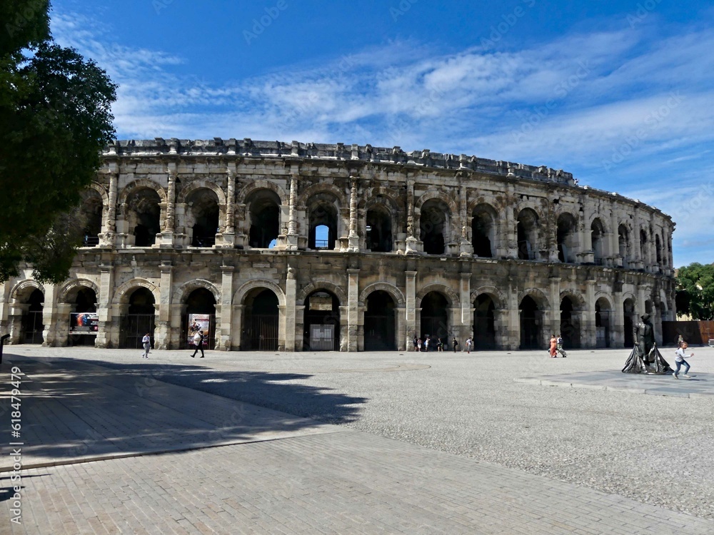 Nîmes, May 2023 : Visit the beautiful city of Nîmes en Provence - Historical city with its arena and ancient theater - View on the arena	

