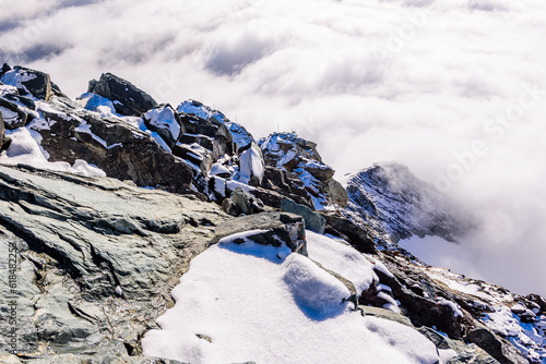 The ridge of the highest Austrian mountain Grossglockner in clouds.  photo