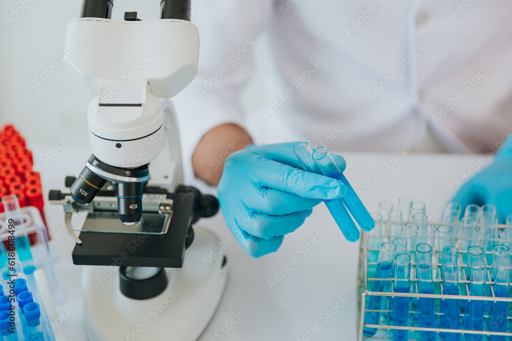 Medical Research Laboratory: Close-Up of Male Scientist test analysis Advanced science laboratory for medicine biotechnology development of microbiology Medical Research Laboratory: Close-Up of Male Scientist test analysis Advanced science laboratory for medicine biotechnology development of microbiology