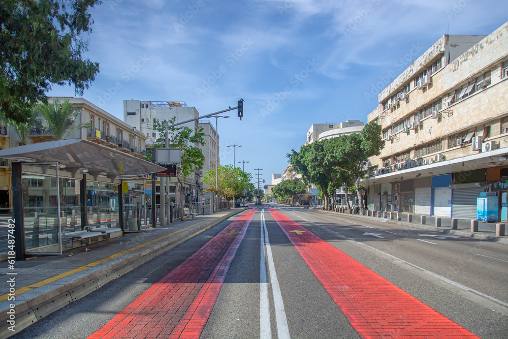 A symmetrical view over a public transportation lane on the main road in Downtown Haifa during Yom-Kippur with no cars on the road A symmetrical view over a public transportation lane on the main road in Downtown Haifa during Yom-Kippur with no cars on the road