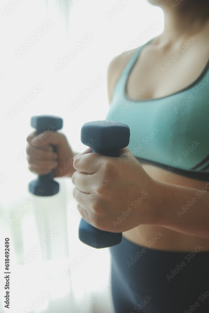 Woman exercise workout in gym fitness breaking relax holding apple fruit after training sport with dumbbell and protein shake bottle healthy lifestyle bodybuilding, Athlete builder muscles lifestyle. Woman exercise workout in gym fitness breaking relax holding apple fruit after training sport with dumbbell and protein shake bottle healthy lifestyle bodybuilding, Athlete builder muscles lifestyle.