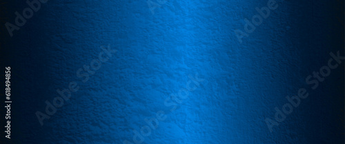 Blue abstract lava stone texture background, dark blue rough grainy stone or concrete wall texture background, Blue background with faint texture and bright center and black vignette border.