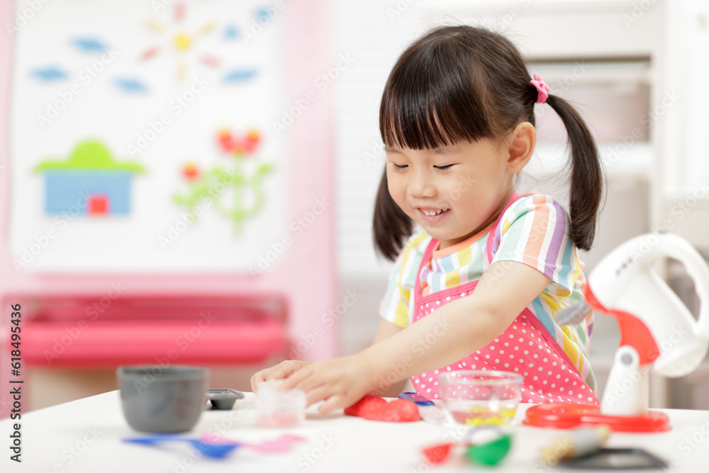 young girl pretend play food preparing at home young girl pretend play food preparing at home