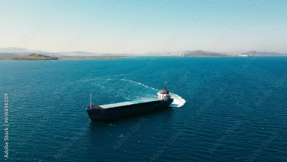 Bulk carrier vessel manoeuvring in sea, Aerial view Bulk carrier vessel manoeuvring in sea, Aerial view
