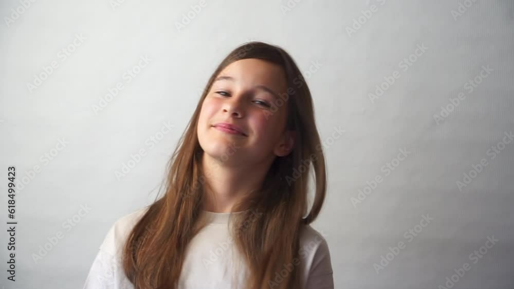 Portrait of cute brunette girl smiling and looking straight into camera Portrait of cute brunette girl smiling and looking straight into camera