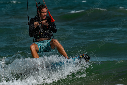 Kite surfer rides the waves