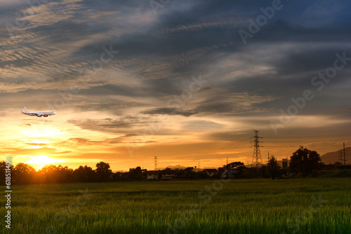 Commercial airplane above sea with sunset in summer season over beautiful scenery background, Concept business travel and transportation summer vacation travel.