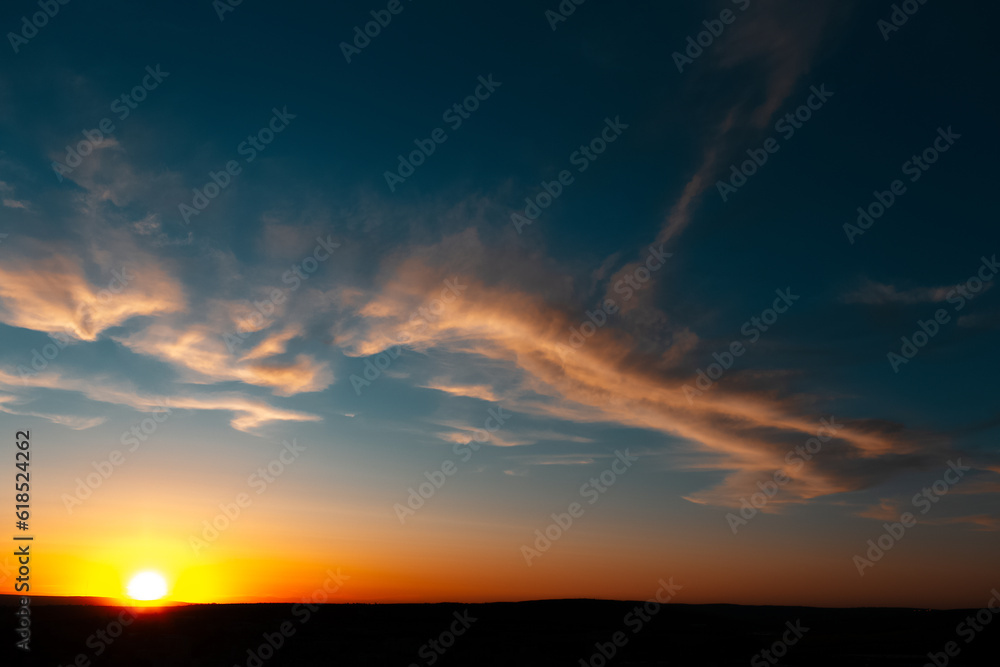 Natural landscape of beautiful sunset  or sunrise with clouds, dark blue sky.