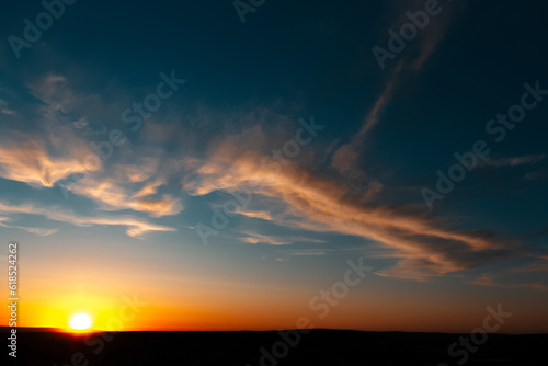 Natural landscape of beautiful sunset or sunrise with clouds, dark blue sky.