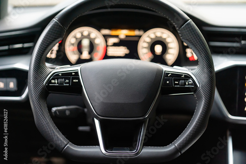 Control buttons on the steering wheel of the car photo