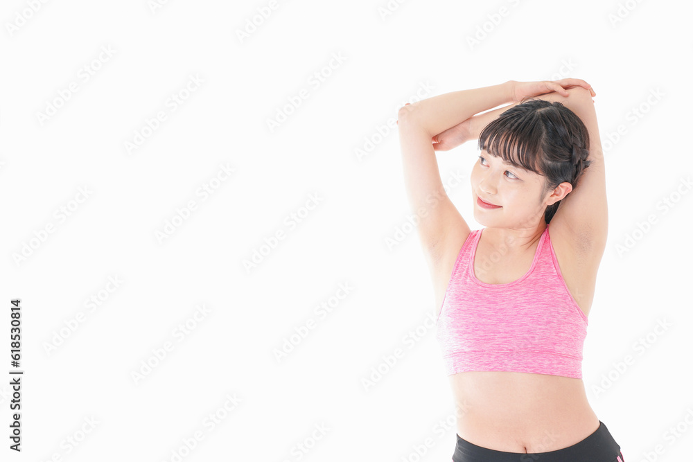 ウォーミングアップをする若い女性 ウォーミングアップをする若い女性