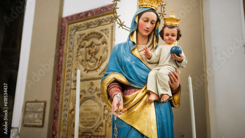 The Madonna with baby Jesus in her arms statue of a church