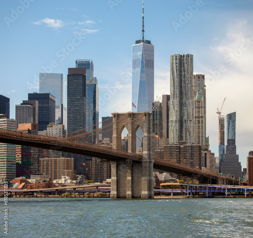 Famous downtown New York skyline Brooklyn Bridge and Manhattan in the morning sunlight  © sweethelen