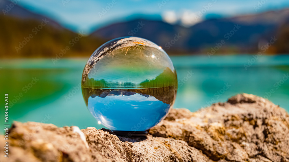 Crystal ball alpine landscape shot with reflections at Lake Pillersee, Saint Ulrich, Tyrol, Austria Crystal ball alpine landscape shot with reflections at Lake Pillersee, Saint Ulrich, Tyrol, Austria
