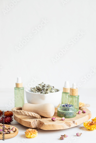 Botanical blends, herbs, essencial oils for naturopathy. Natural remedy, herbal medicine, blends for bath and tea on wooden table background