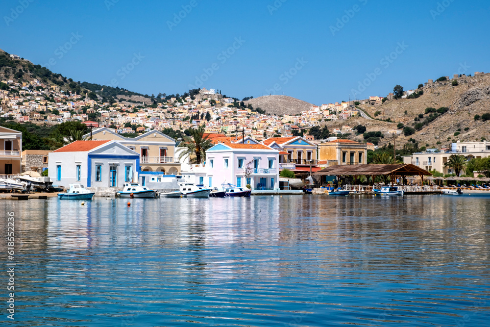 Colorful Houses by the Mediterranean Sea on Pedi Harbor, Symi, Greece