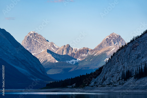 Stunning nature views in Kananaskis during summer time with early morning, sunrise glow on scenic mountain scenery.