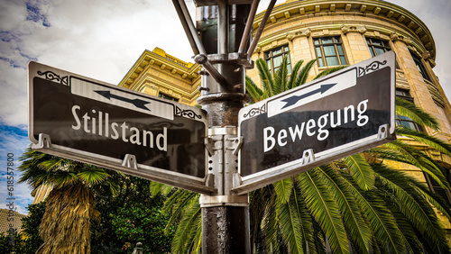 Фотография Signposts the direct way to Movement versus Standstill