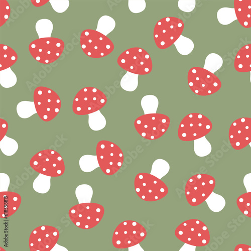 Simple seamless pattern with mushrooms on a green background.Vector graphics.