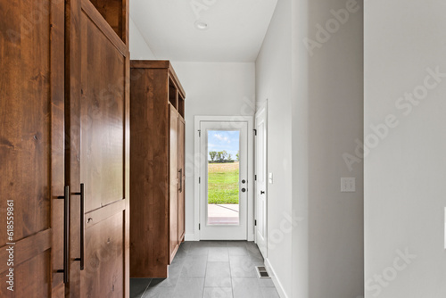Brand new stain and finished hardwood floors and cabinetry in hallway