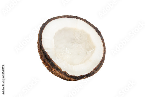 Half a coconut in a coconut shell on a white background.