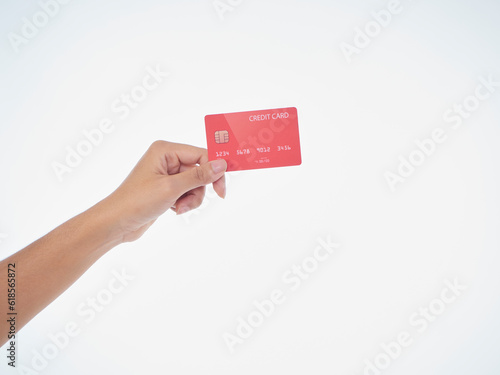 Woman holding credit card on white background