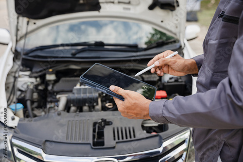 car mechanic working Engine repair and maintenance service © Witoon