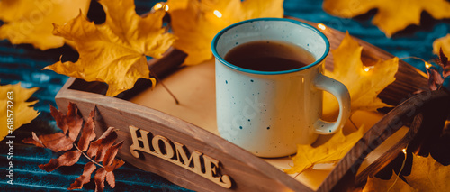 Cup Warm Coffee and Yellow Autumn Leaves by the Window. Fall Season and Home Cozy Concept. Vintage style.