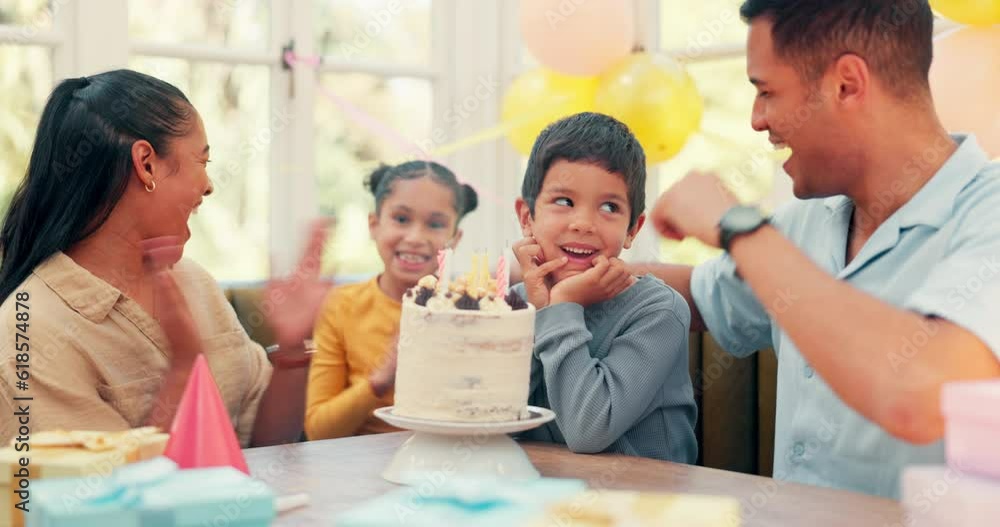 Birthday cake, family and happy kid blowing candle flame for youth celebration, fun home party or excited group event. Parents love, candy and young child smile, happiness and cheers for special day Birthday cake, family and happy kid blowing candle flame for youth celebration, fun home party or excited group event. Parents love, candy and young child smile, happiness and cheers for special day