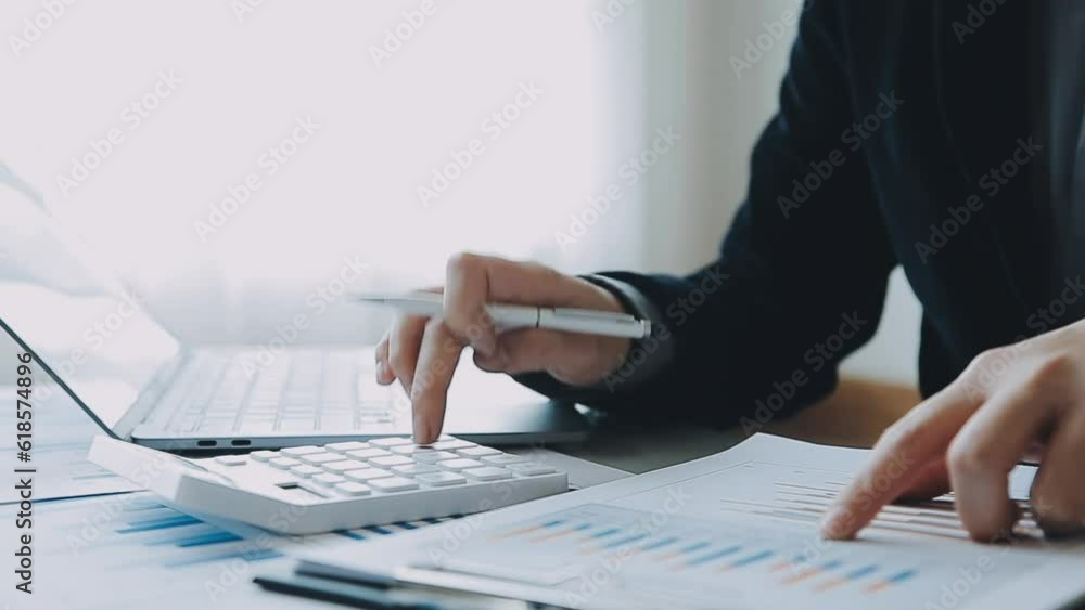 Businessmen are calculating income-expenditure and analyzing real estate investment data, Accounting Financial and tax systems concept.