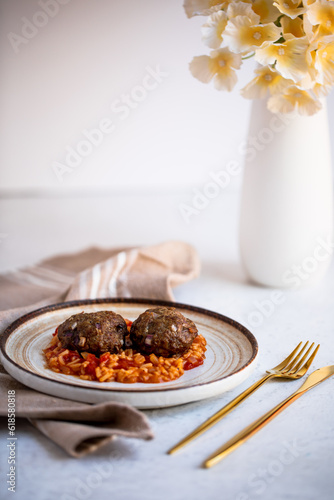 Healthy lunch meatballs and tomato rice on a white background