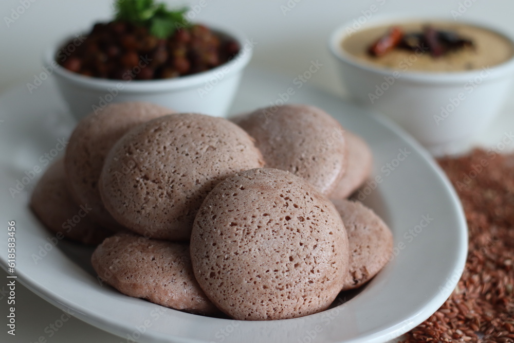 Navara rice idly served black chickpea curry. Steamed savoury rice cake made by a batter of fermented de husked black lentils and navara rice. Navara rice idly served black chickpea curry. Steamed savoury rice cake made by a batter of fermented de husked black lentils and navara rice.