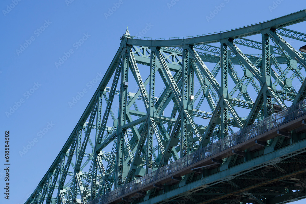 Beautiful Pont Jacques-Cartier bridge on the sunny side in the early morning. Made in steel in the 20's