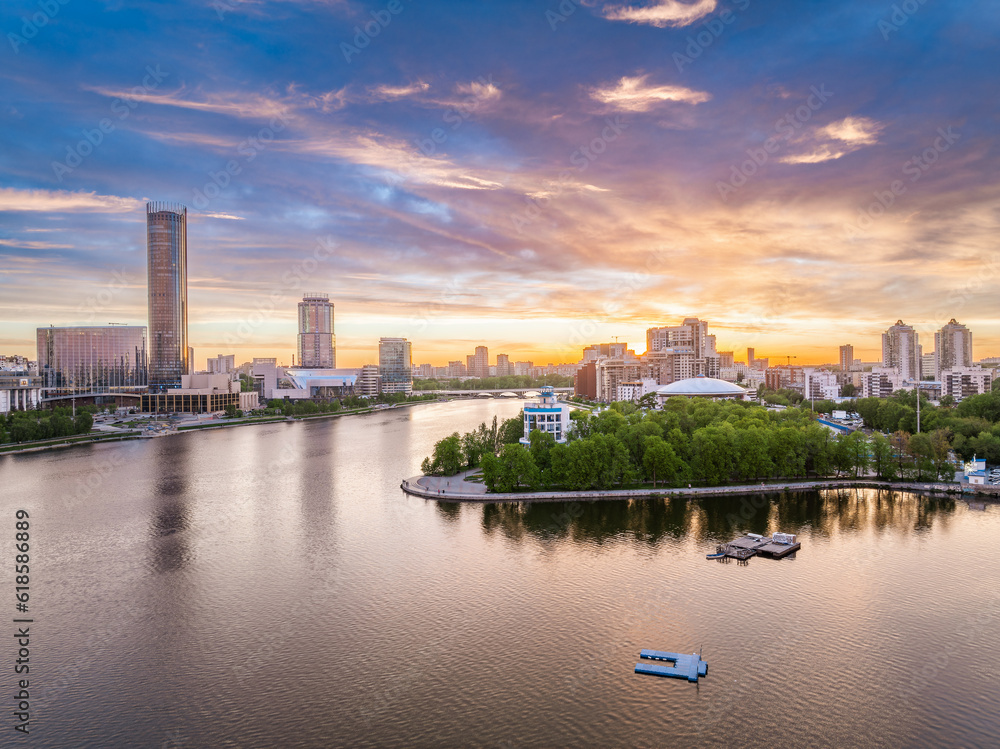 Yekaterinburg city with Buildings of Regional Government and Parliament, Dramatic Theatre, Iset Tower, Yeltsin Center, panoramic view at summer sunset. Yekaterinburg city with Buildings of Regional Government and Parliament, Dramatic Theatre, Iset Tower, Yeltsin Center, panoramic view at summer sunset.