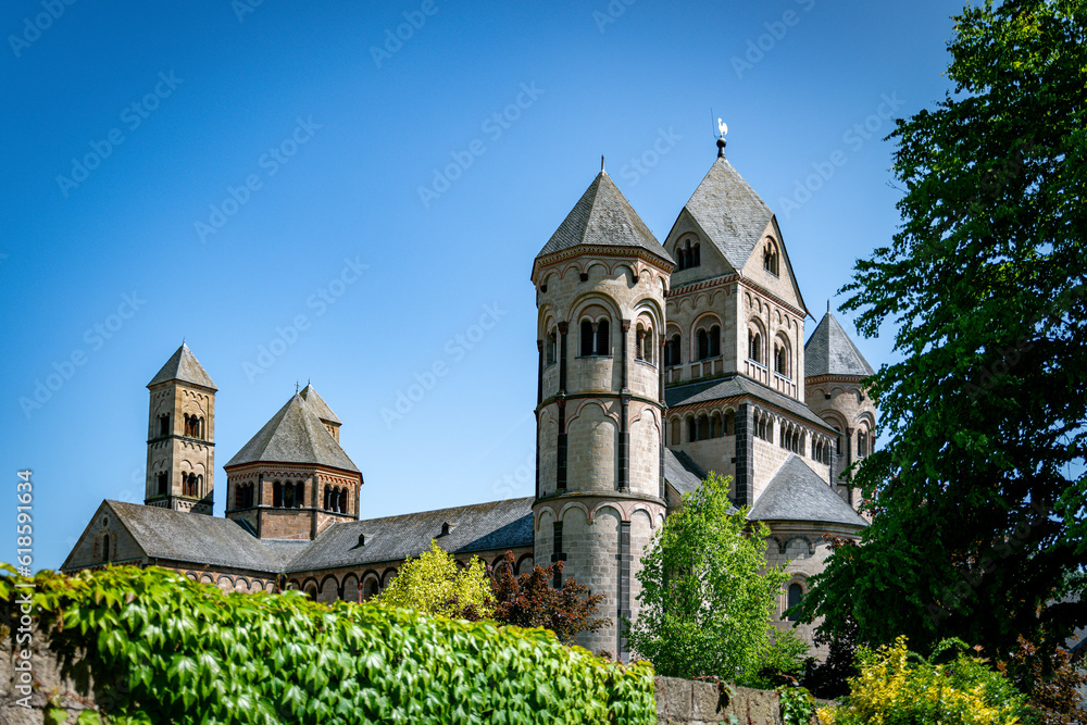 The abbey of maria laach in germany on a sunny day with blue sky