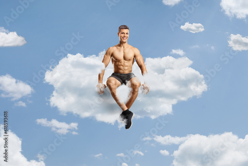 Shirtless bodybuilder sitting on a cloud