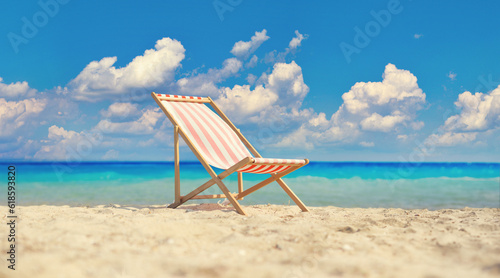 Fototapeta Naklejka Na Ścianę i Meble -  Deck chair on a sandy beach