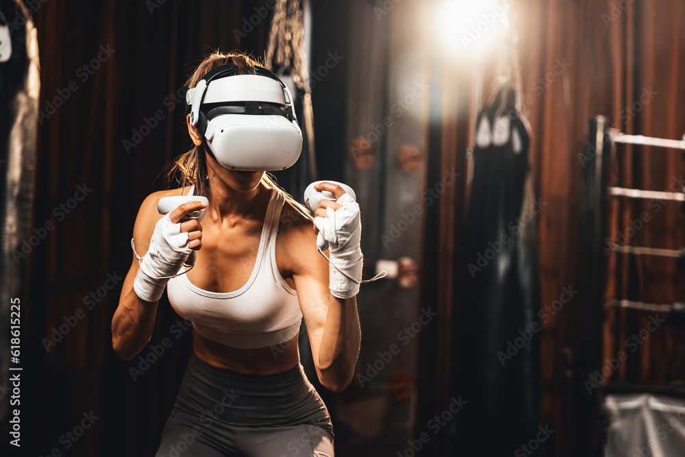 Stockfoto Female boxer training with VR or virtual reality, wearing VR