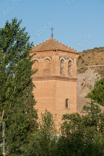 tower of the church of yator (granada) photo