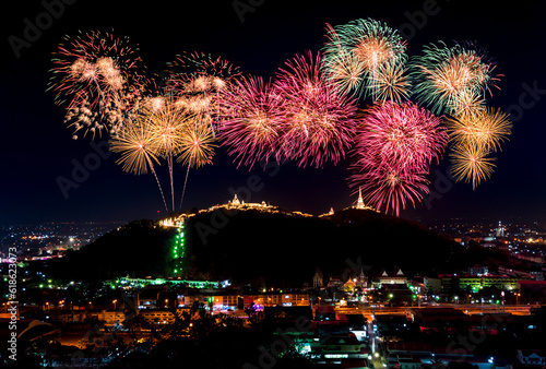 firework festival Pra Nakorn Kiri in Petchaburi Thailand. famous fireworks display over three pagodas on Khao Wang hill at night. photo